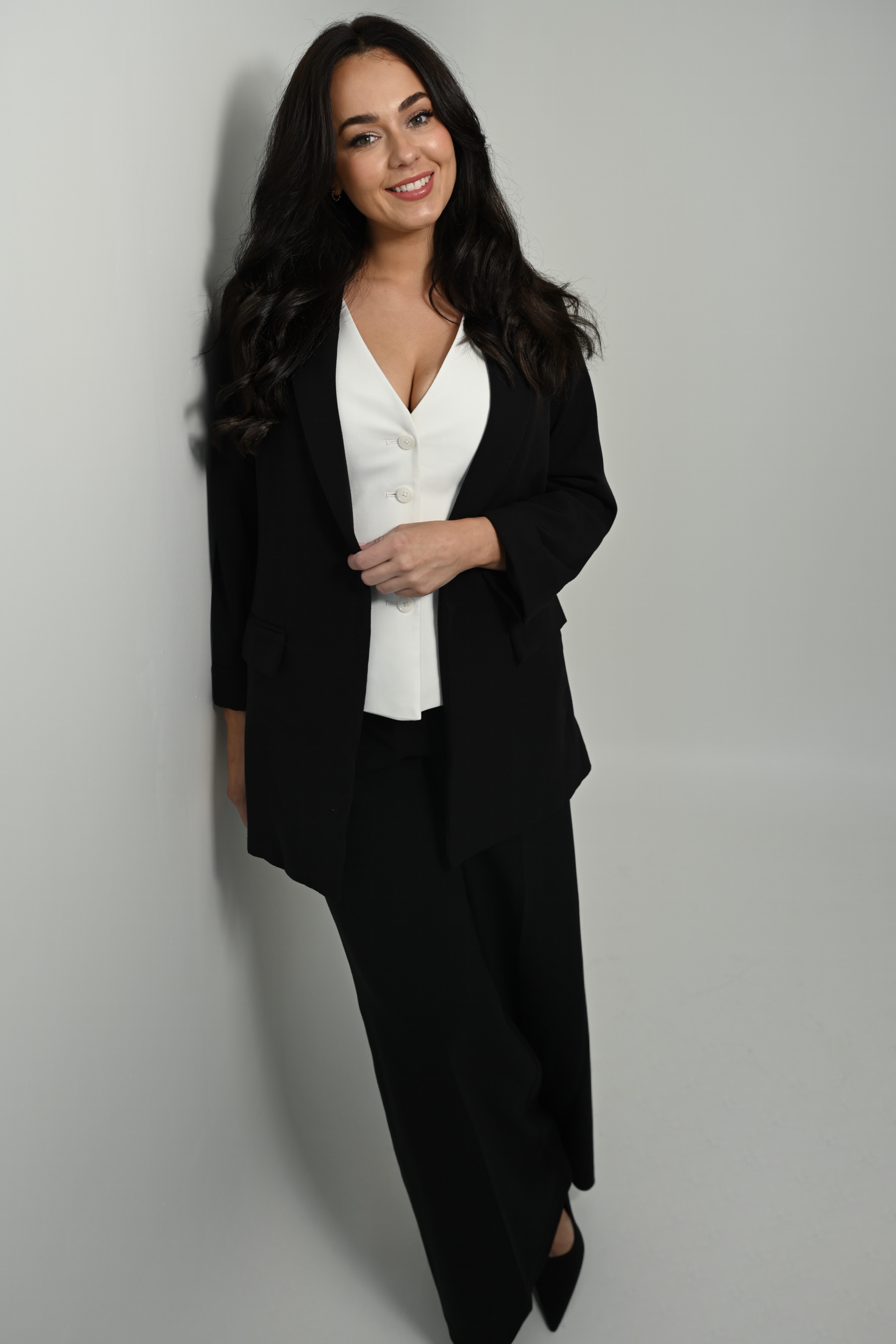 Jasmine in a black blazer